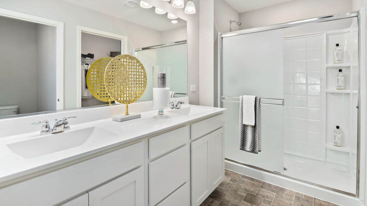 Dual vanity sink with a walk in shower.