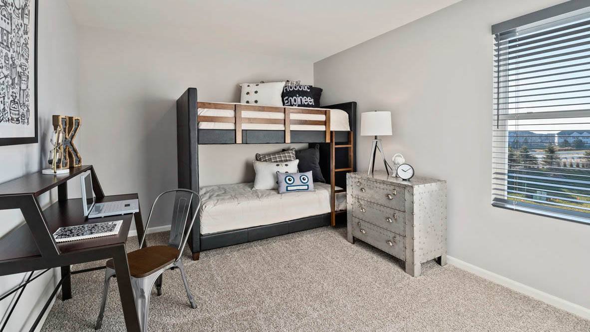 Bedroom with carpet and a window.