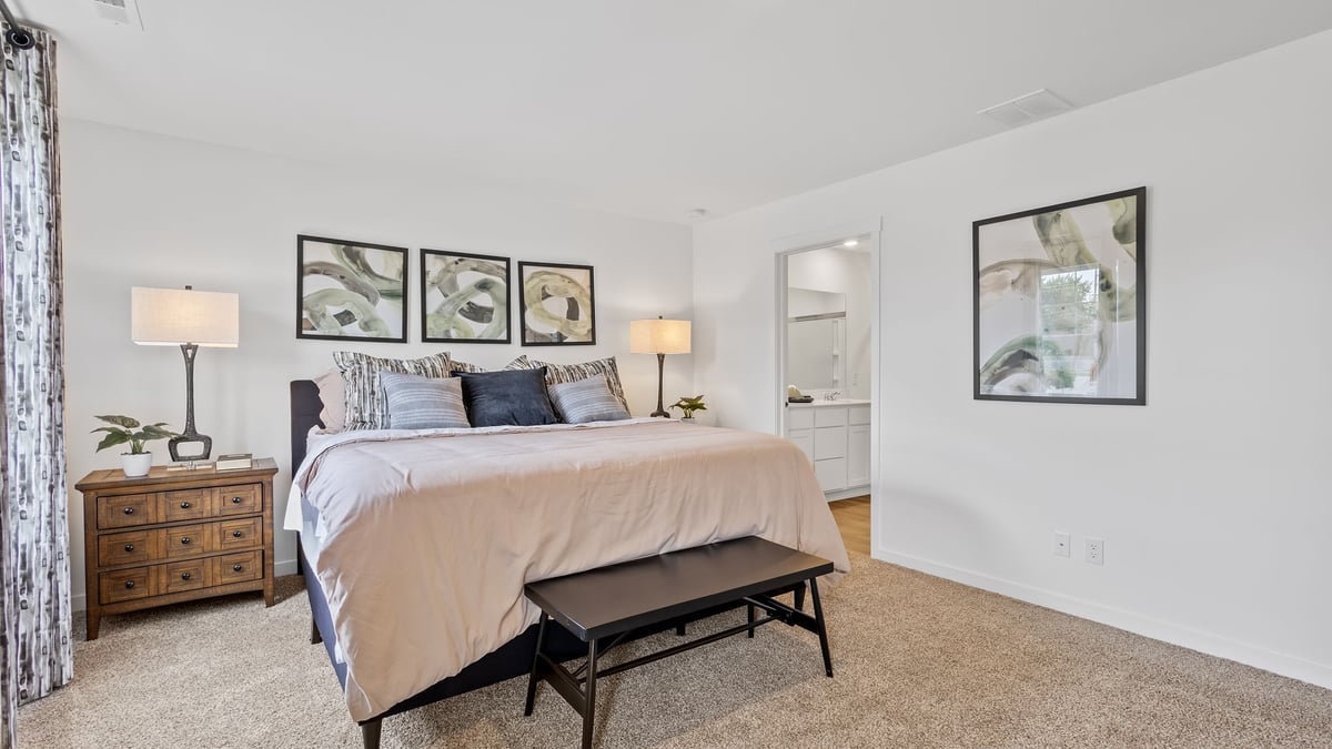 Primary bedroom with carpeted floors and great space.