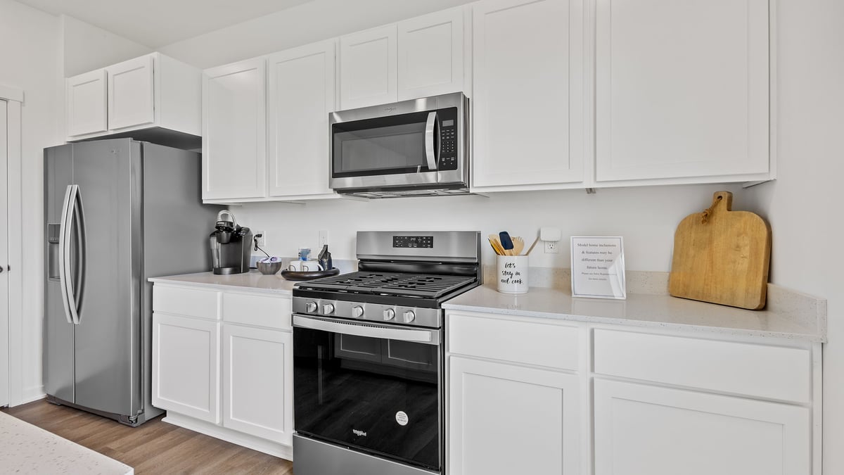 Kitchen with a close view of white cabinets.
