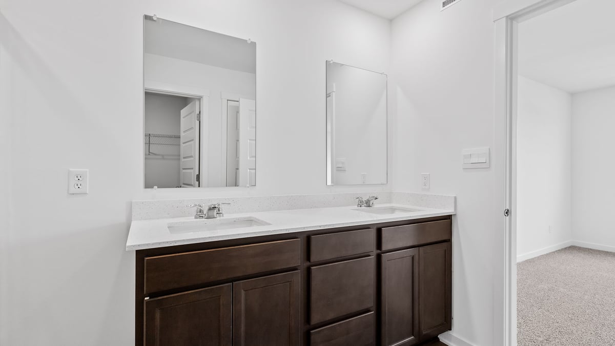 Dual vanity sink with flagstone cabinetry.