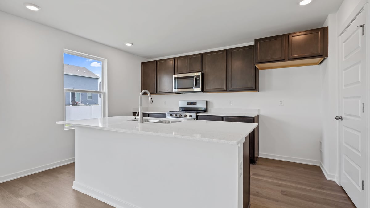 Kitchen with flagstone cabinetry and a side window.