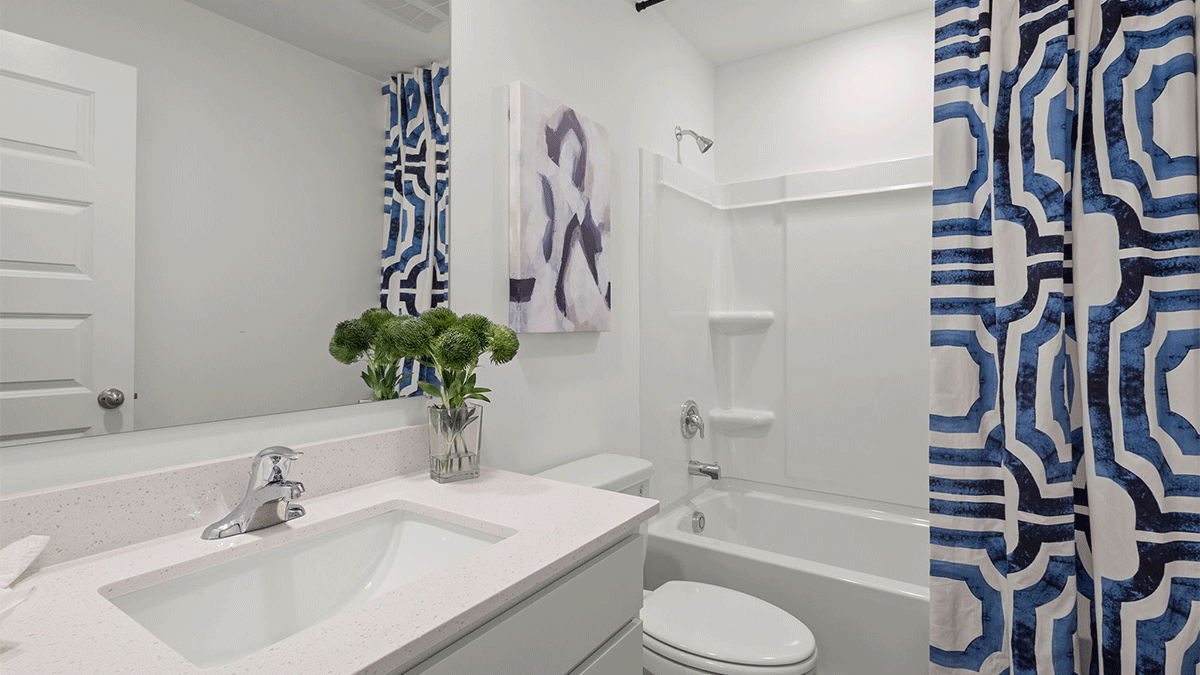 Bathroom with one vanity sink and a shower.