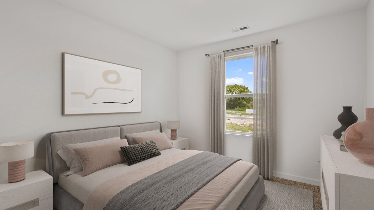Bedroom with carpet and a side window.