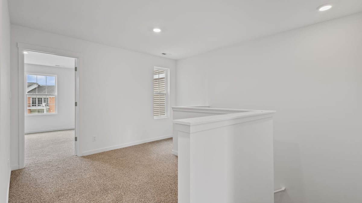 Upstairs loft area with view of hallway.