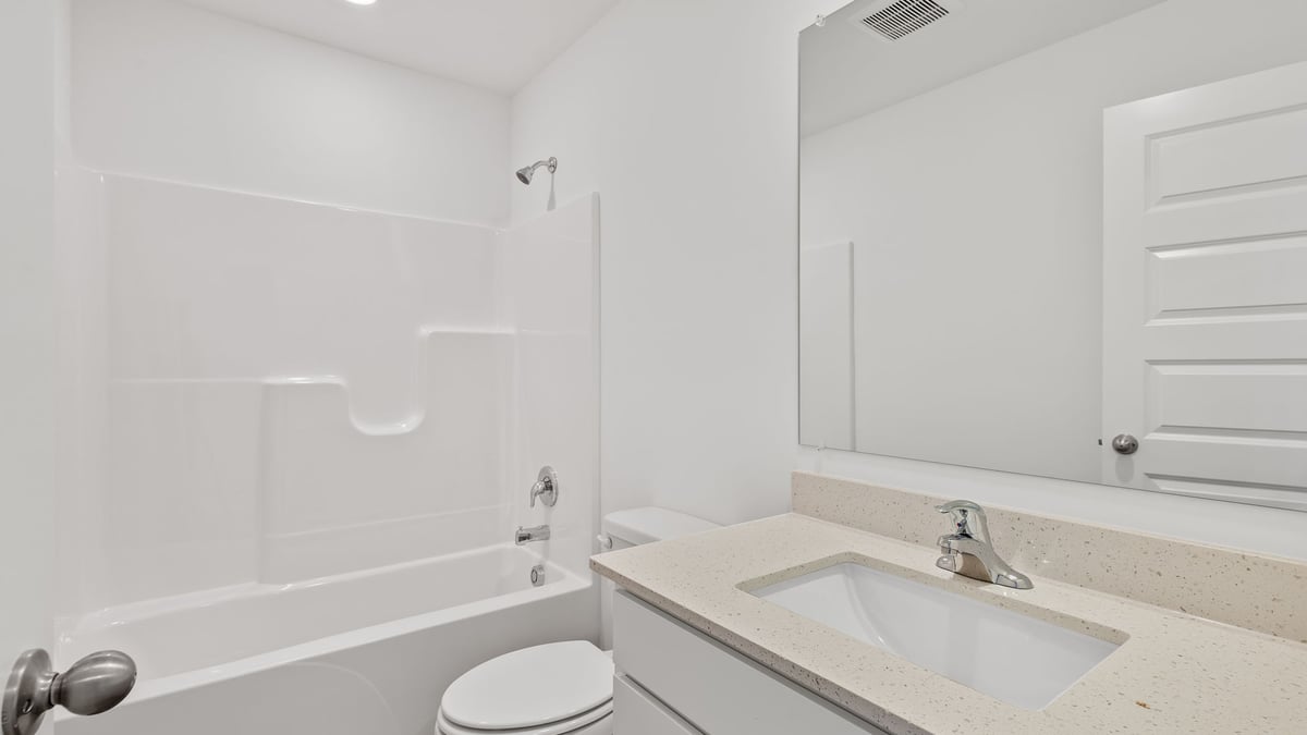 Bathroom with one vanity sink and a shower.