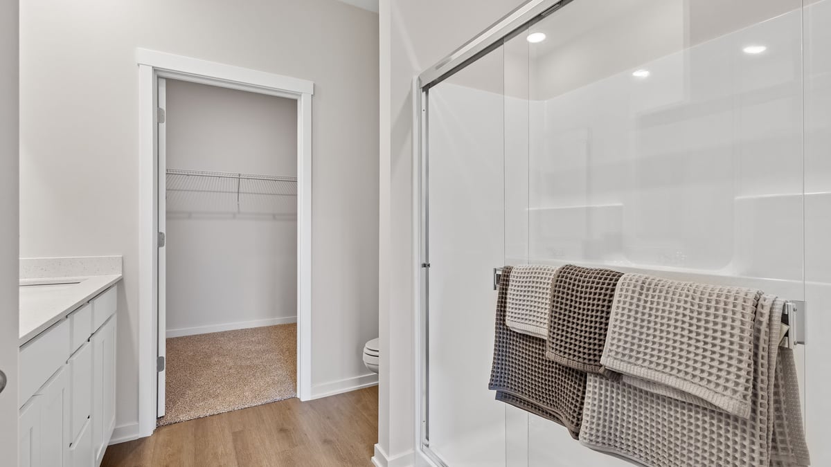 Primary bathroom with walk-in shower and closet.