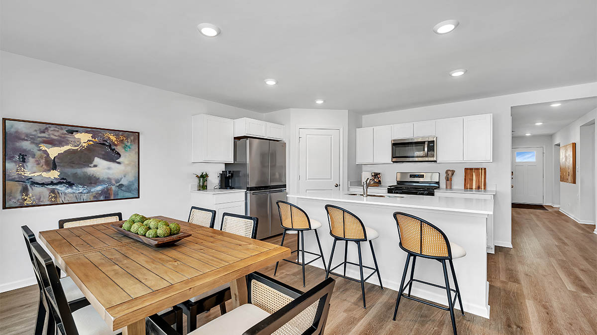 Open concept first floor with the living room, dining room and kitchen next to each other