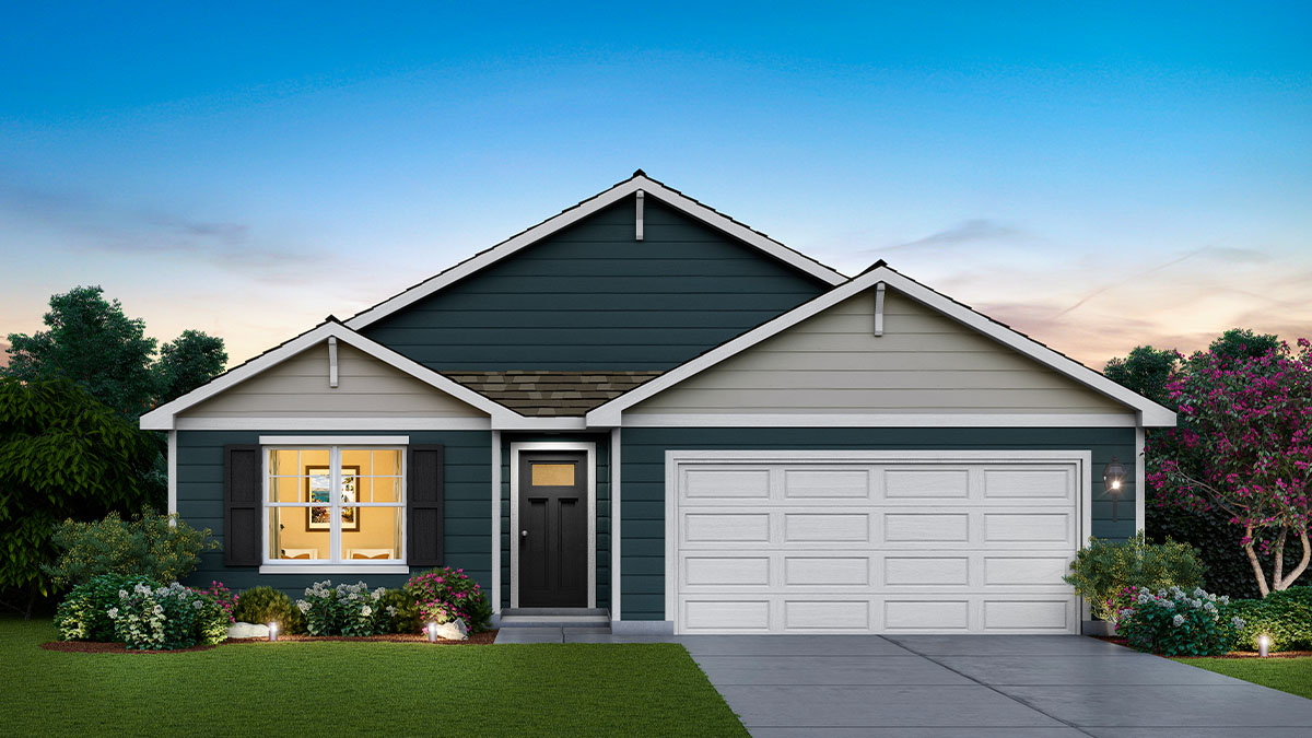 Front exterior of a one story home with stucco exterior and a two car garage