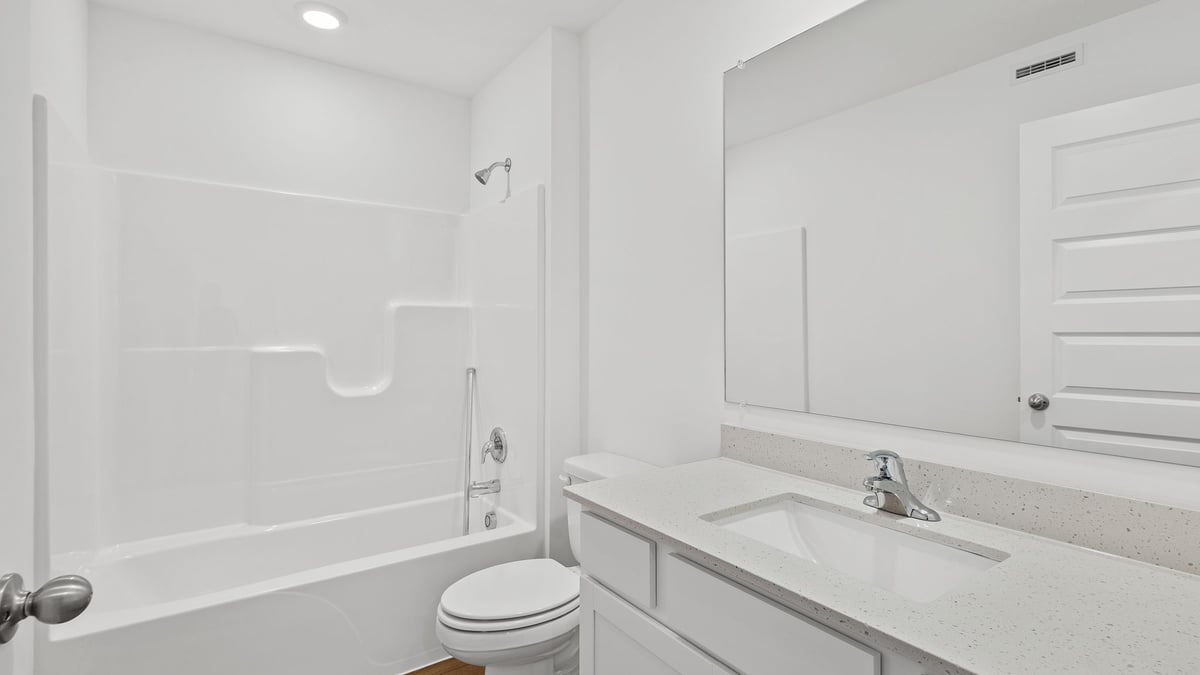 Bathroom with one vanity sink and shower.