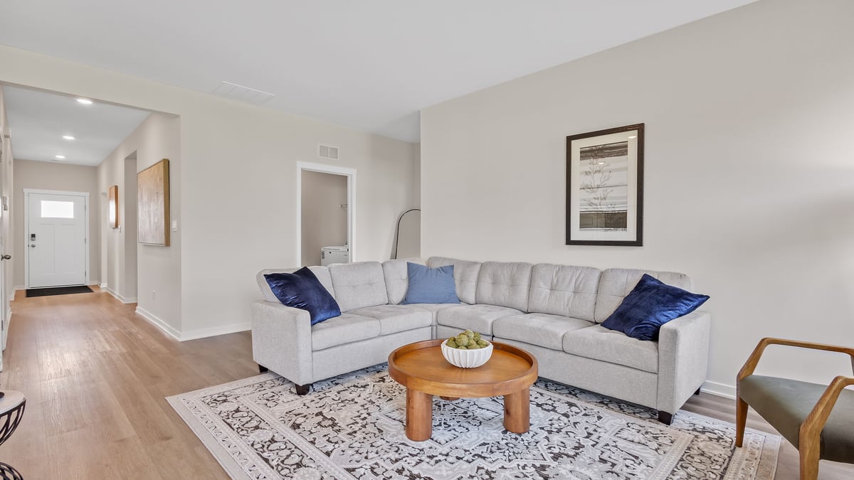 Living area with hard wood floors.