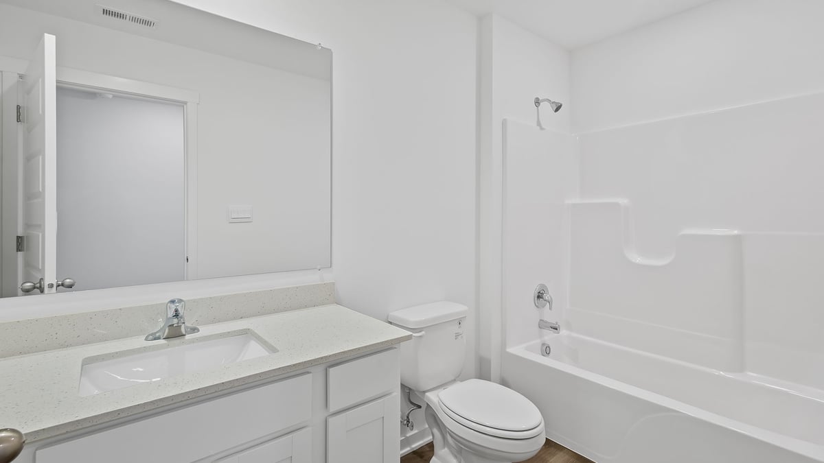 Bathroom with one vanity sink and a shower.