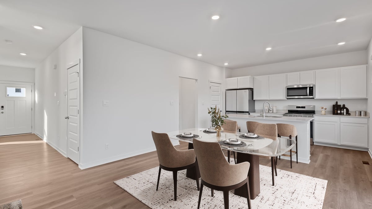 Kitchen and dining area with hard wood flooring and great space.