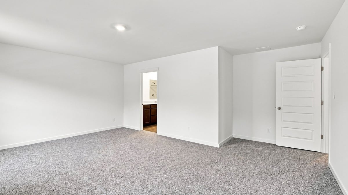 Primary bedroom with en suite bathroom.