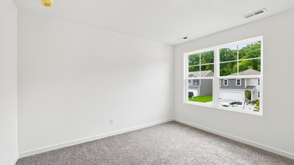 Bedroom with large side window.