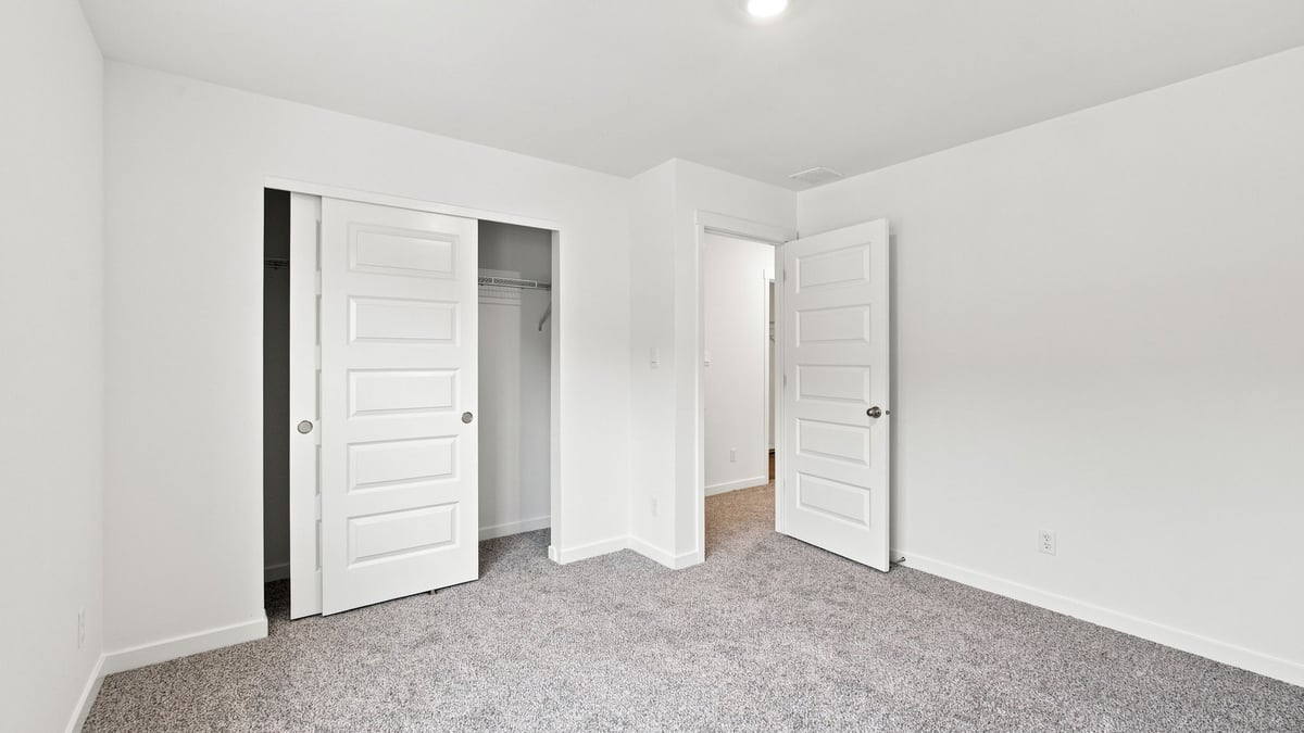 Bedroom with carpeted floors.