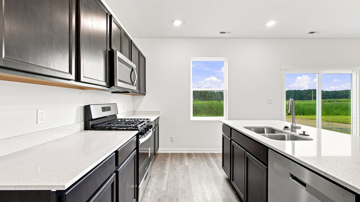 Kitchen with hardwood floors and flagstone cabinetry.