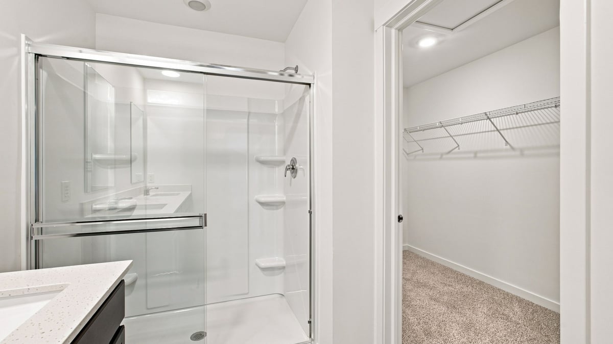 Primary bathroom with walk-in shower and closet.