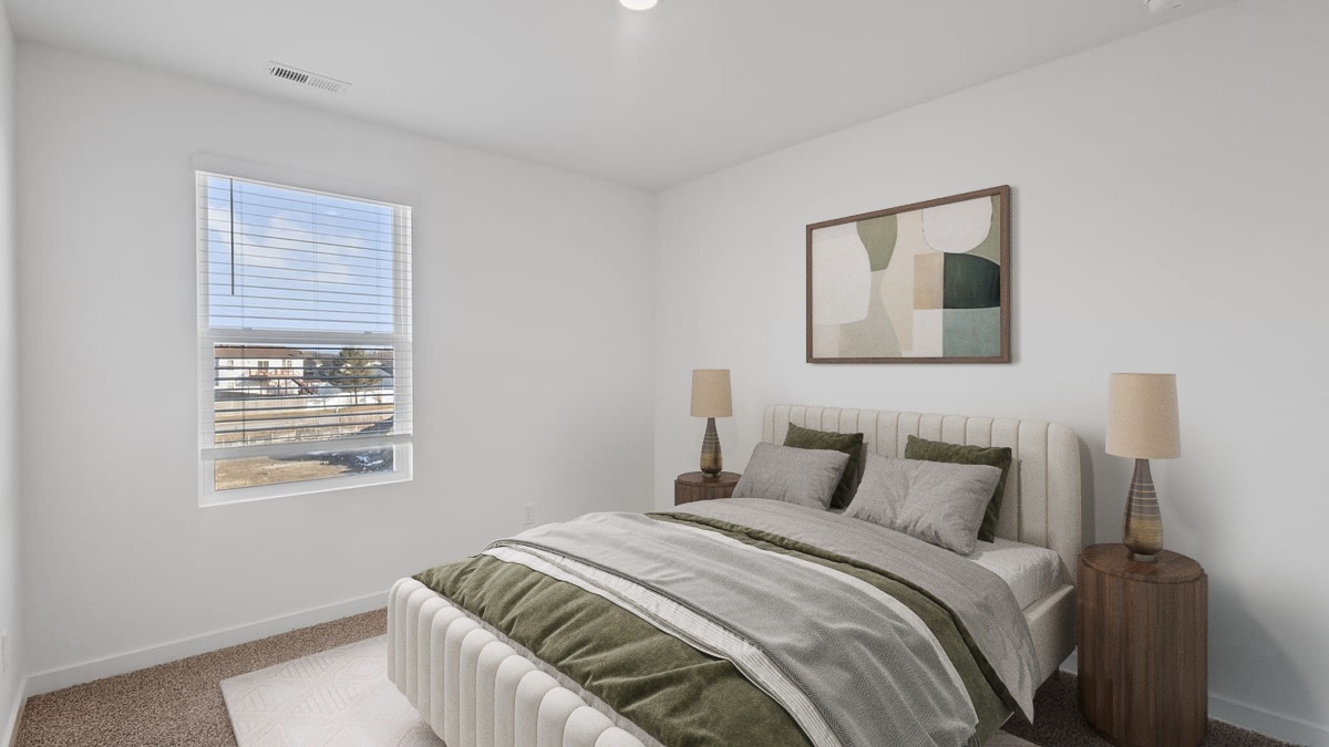 Bedroom with carpeted floors and a side window.