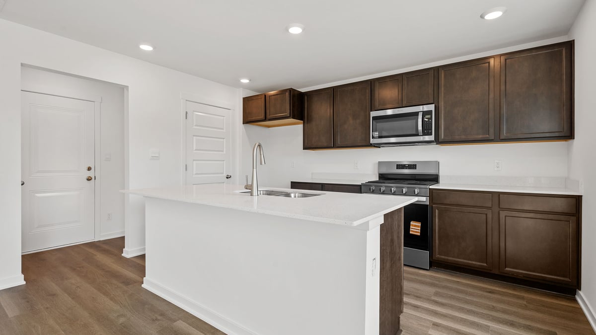 Kitchen with flagstone cabinetry and hard wood floors.