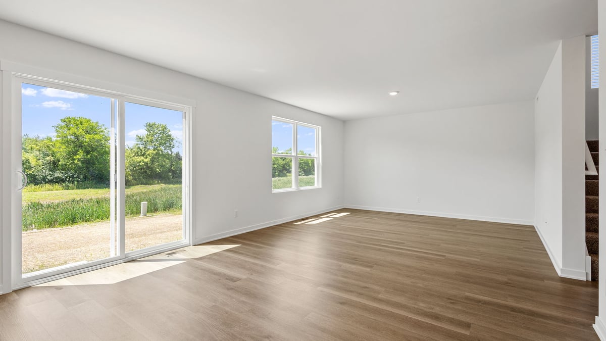 Living room area with glass sliding doors and a big window.