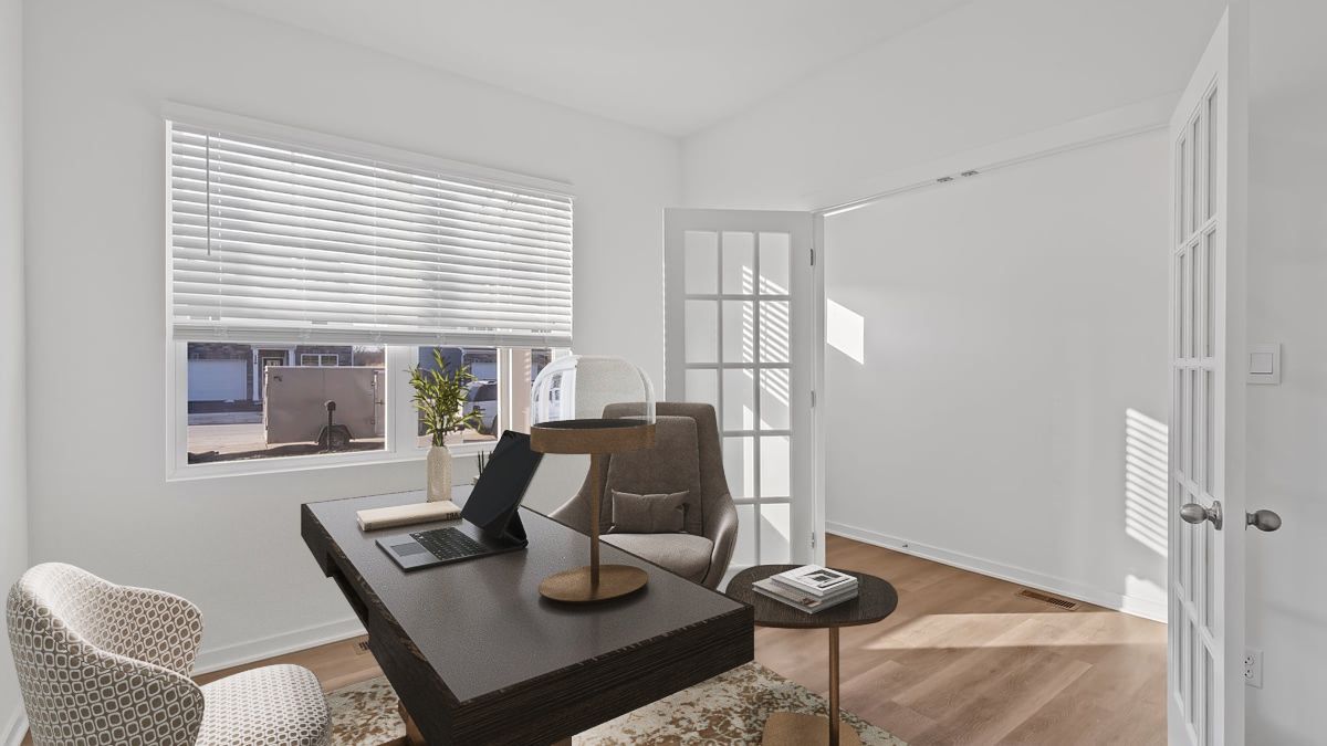 Front room with french swinging doors and a big window.