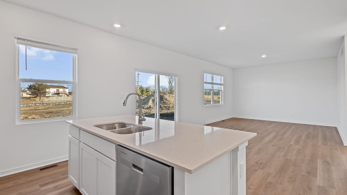 Kitchen island with quartz countertops with a side window.