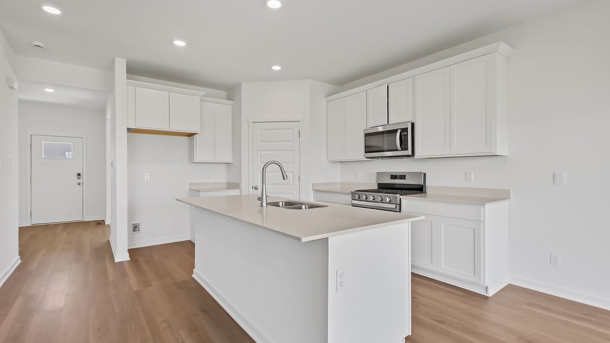 Kitchen with white cabinetry.