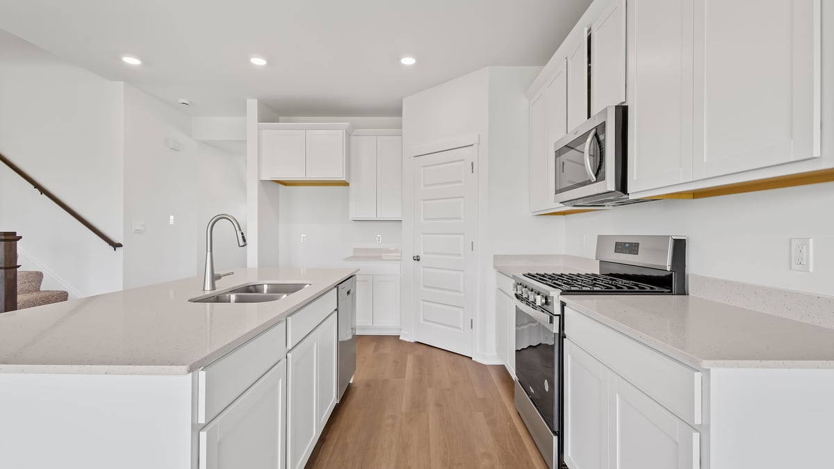 Kitchen with white cabinetry.