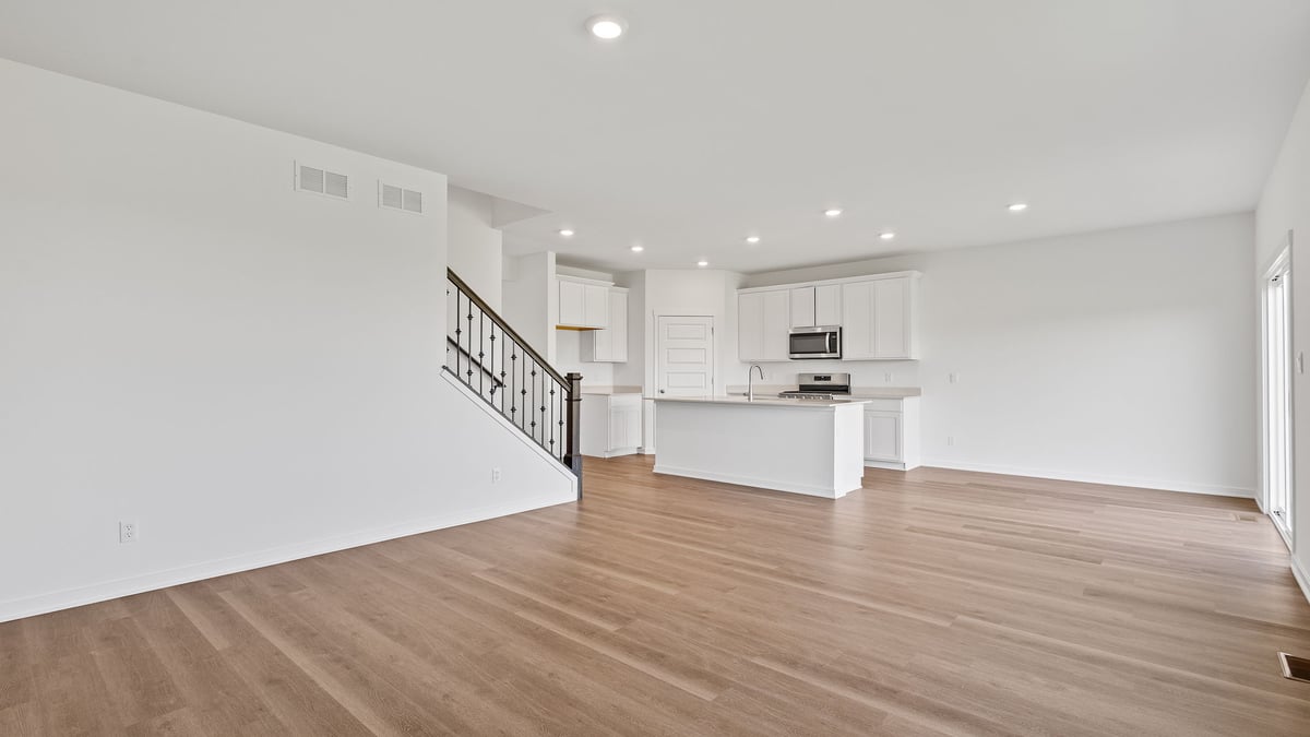 Open living area with hard wood floors.