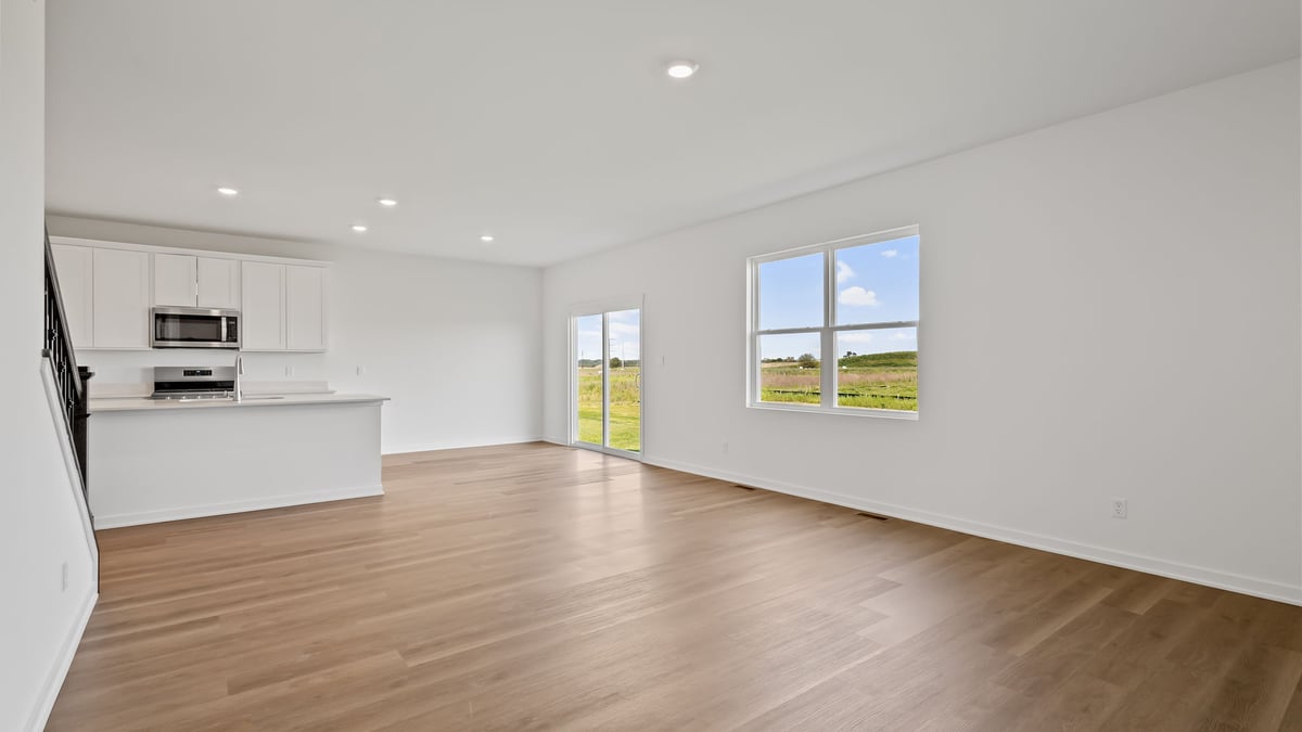 Living are with open concept and windows.