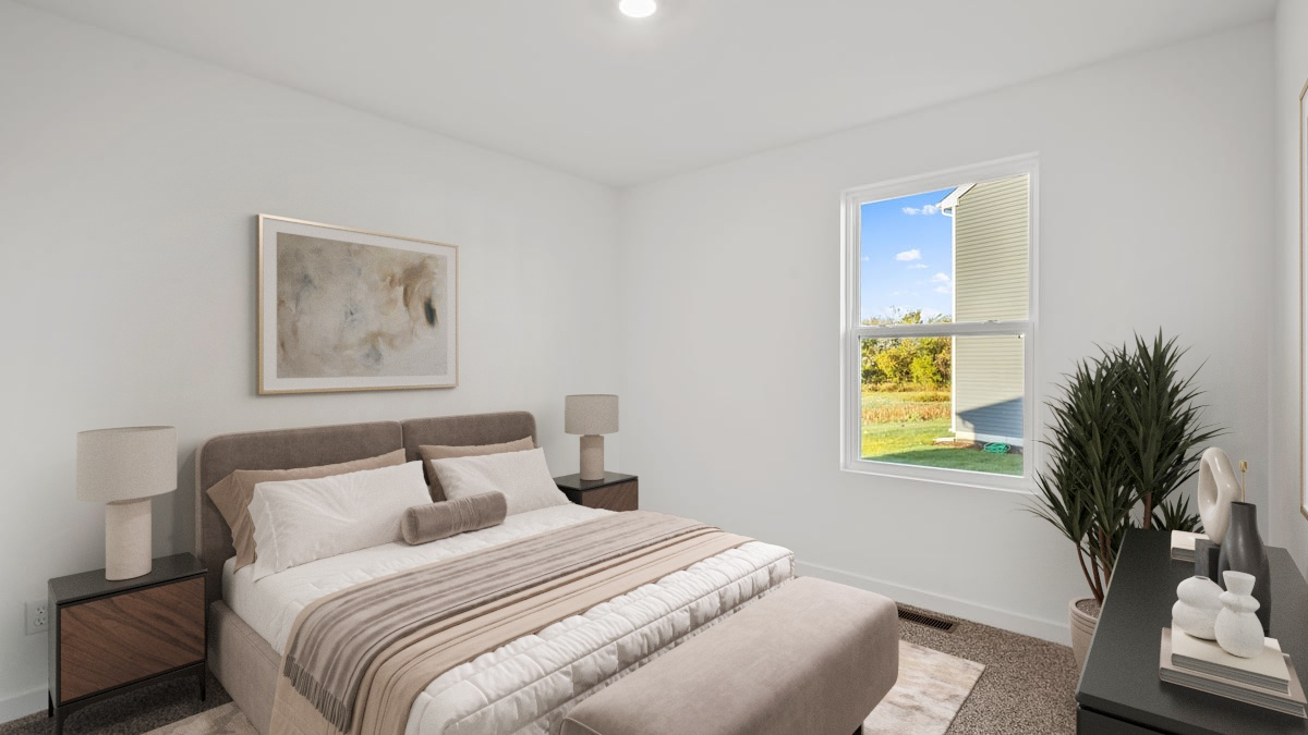 Bedroom with a side window and carpeted floors.