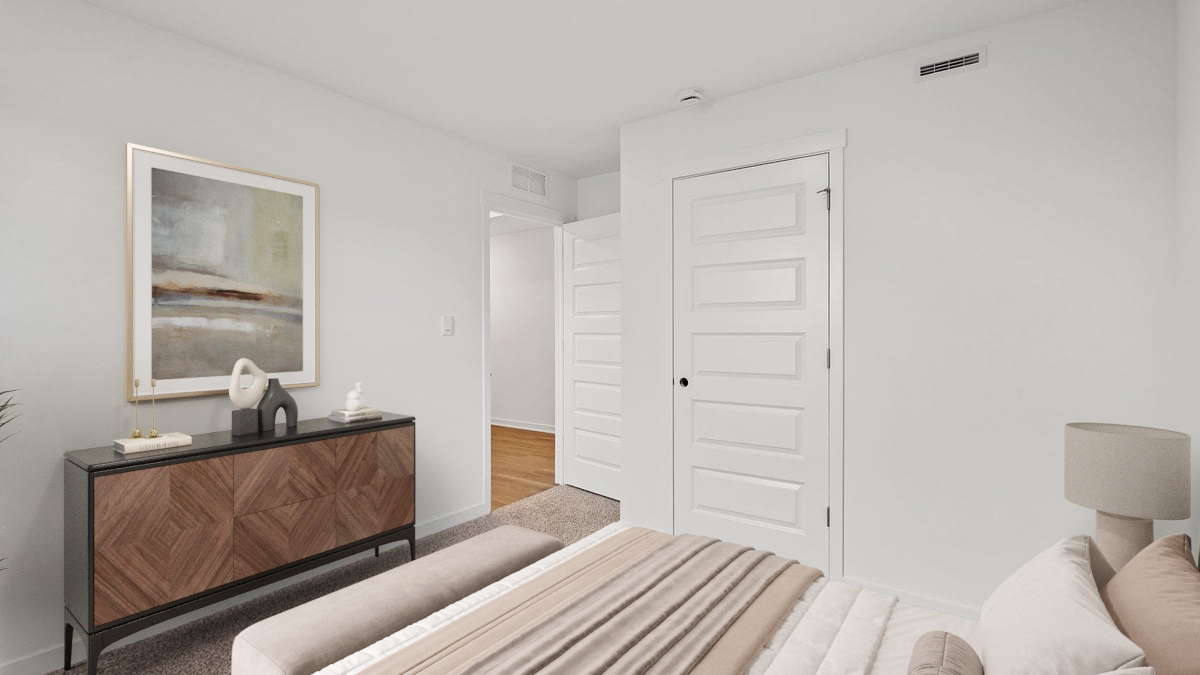 Bedroom with carpeted floors and a closet.