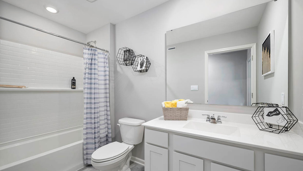 Bathroom with one vanity sink with a shower.