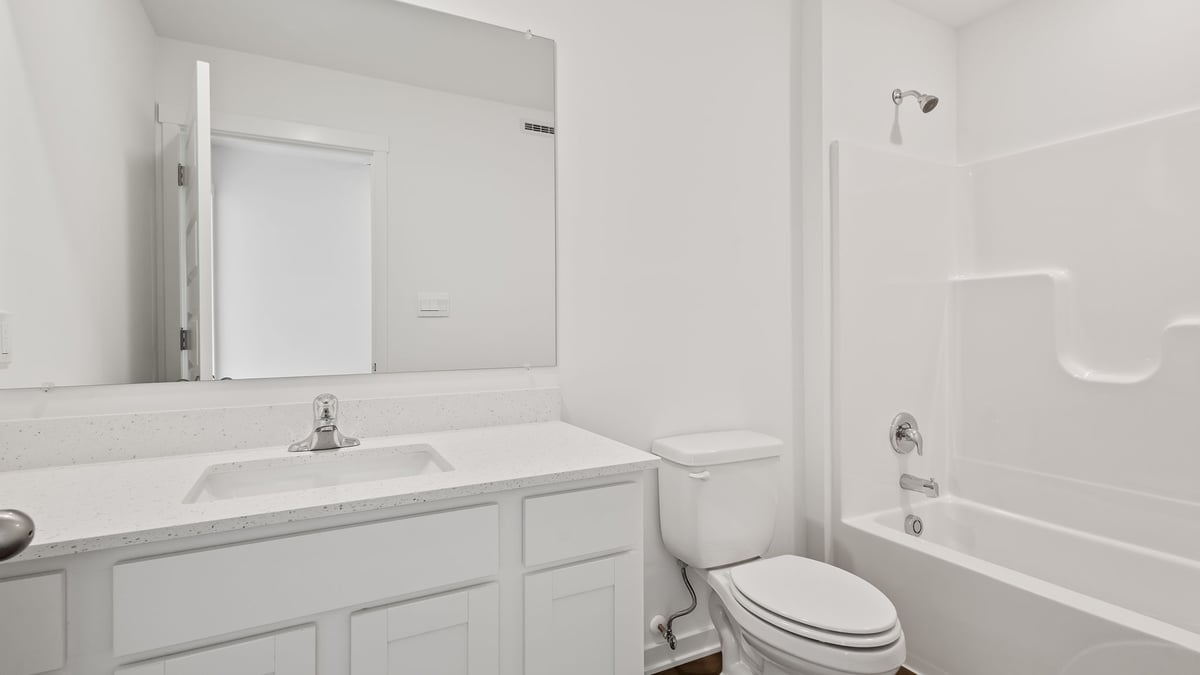 Bathroom with one vanity sink and a shower.