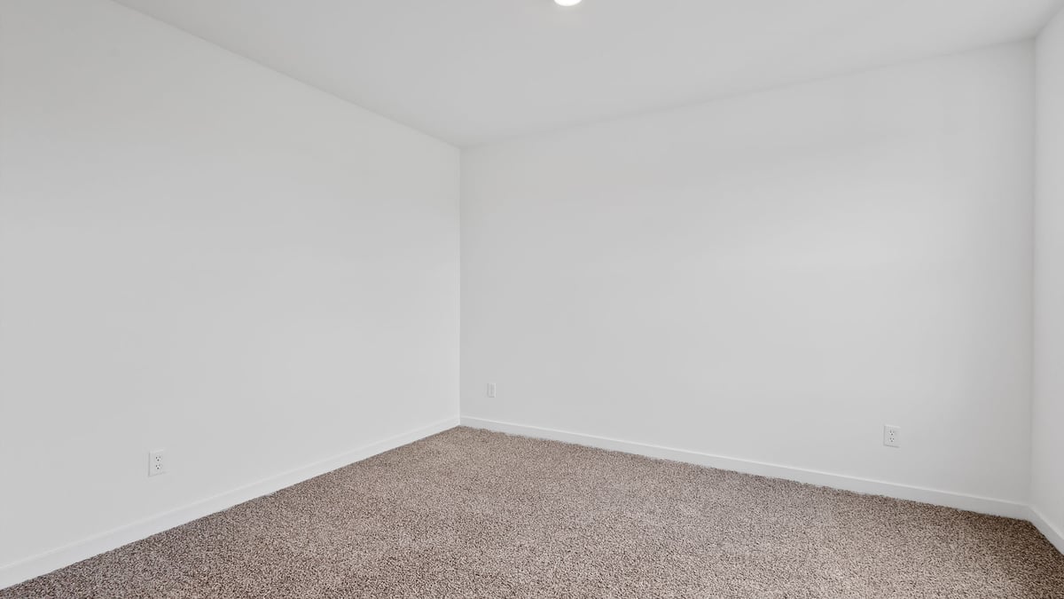 Front room with a carpet.