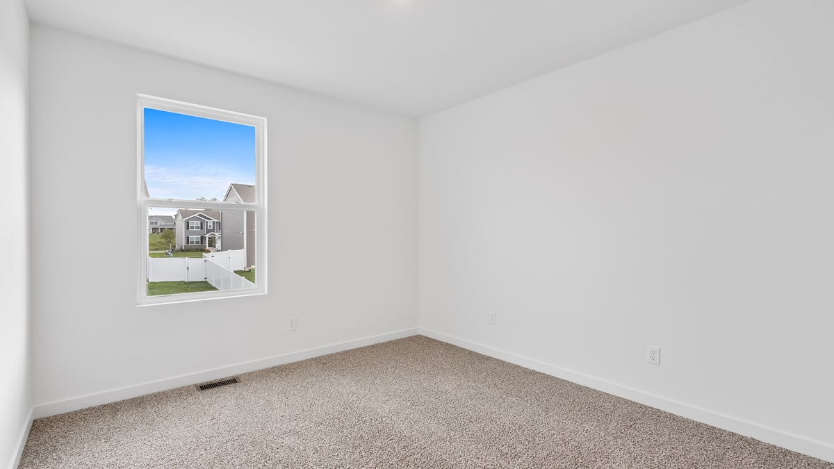 Bedroom with one window and carpet.