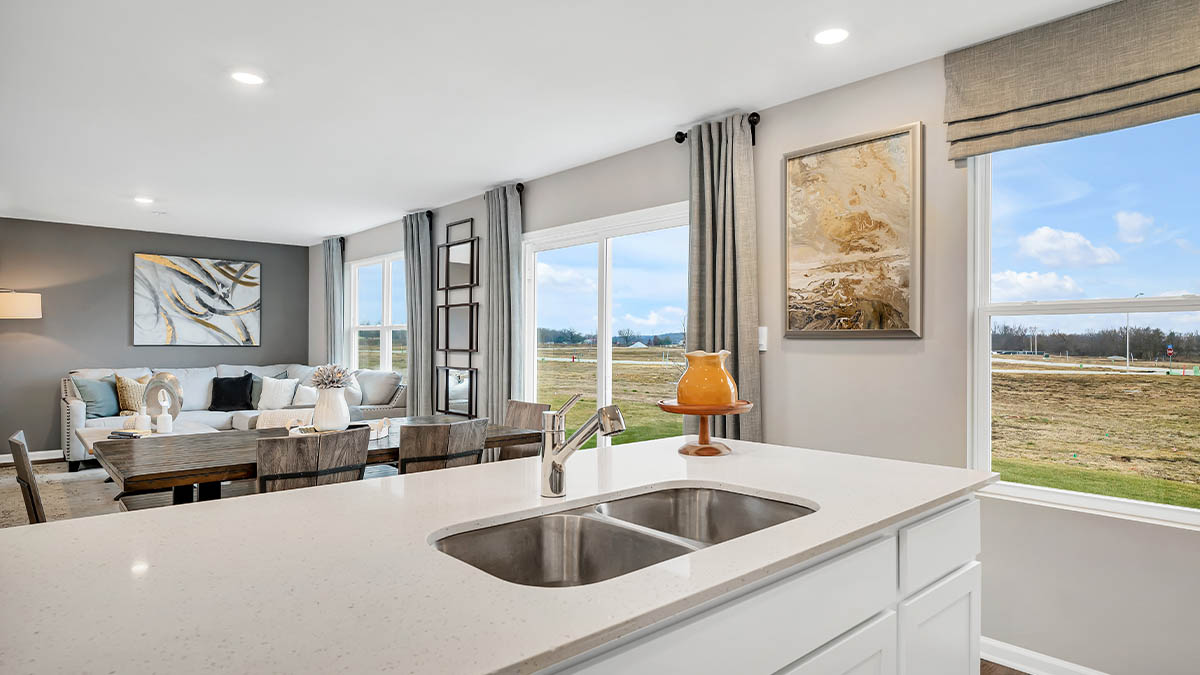 Kitchen island with view of dining area and living area.