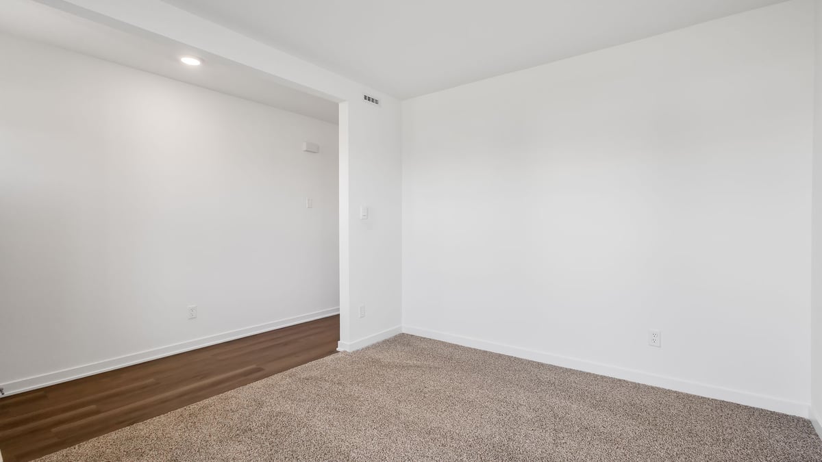 Front room with carpeted floors.