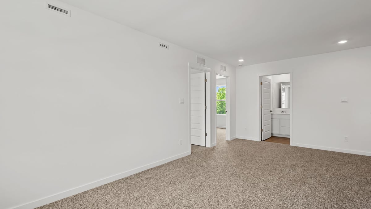 Loft room with carpet.