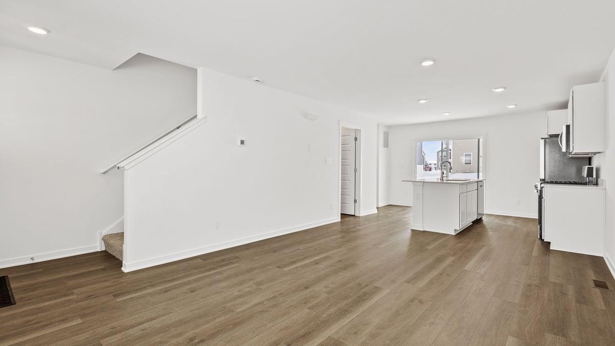 Living room area with hard wood floors.