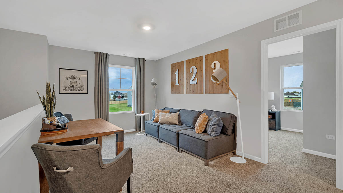 upper level loft with carpeted flooring