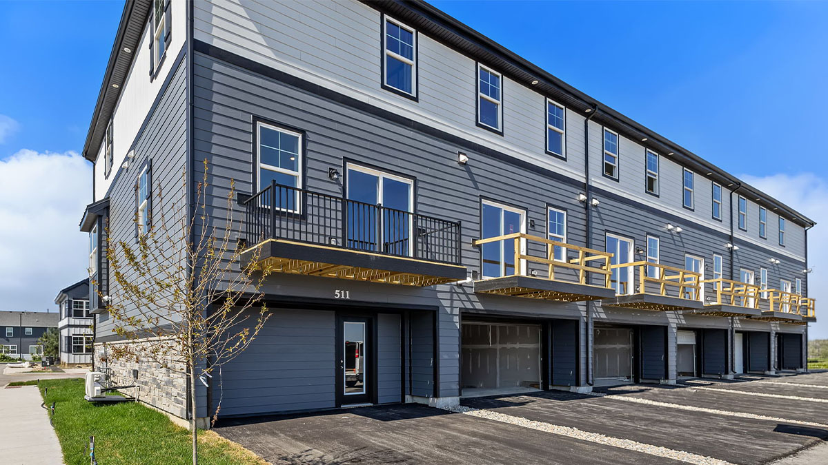 Exterior back-end of three-story townhome.