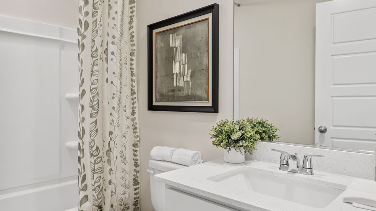 Bathroom with a shower and one vanity sink.