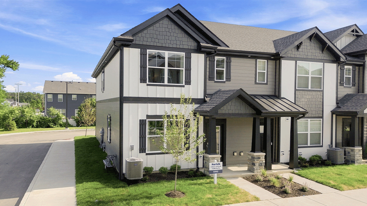 Exterior of two-story townhome end-unit.