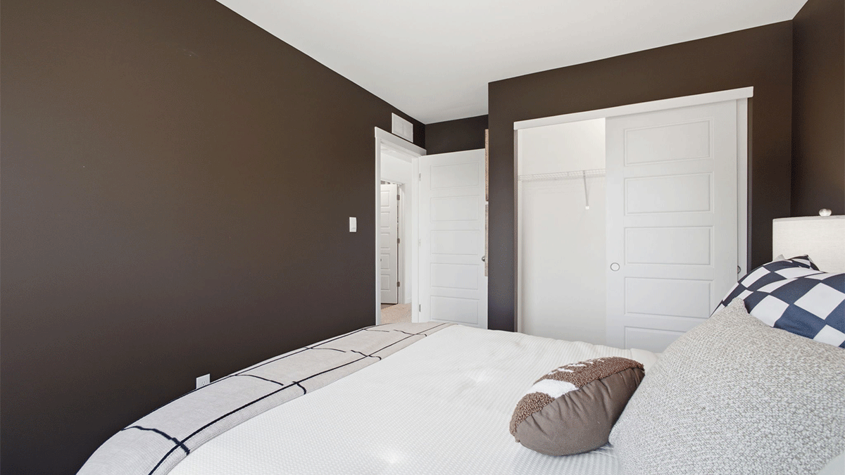 Bedroom with carpeted floors.