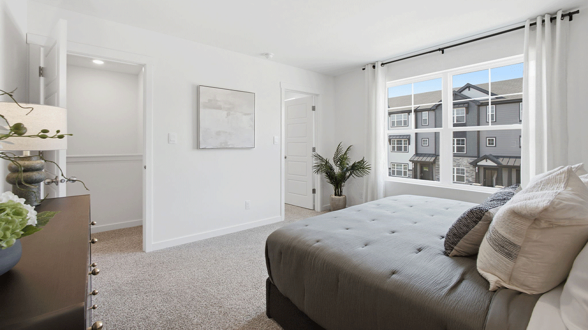 Primary bedroom with a big amounts of space.