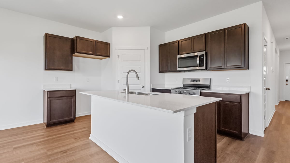 Kitchen with brown cabinets and a kitchen island.