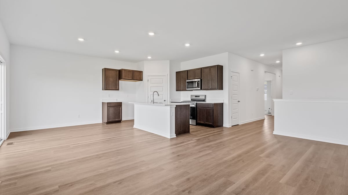 Living area view of kitchen and dining area.