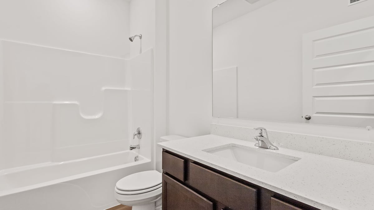 Bathroom with one vanity sink and a shower.
